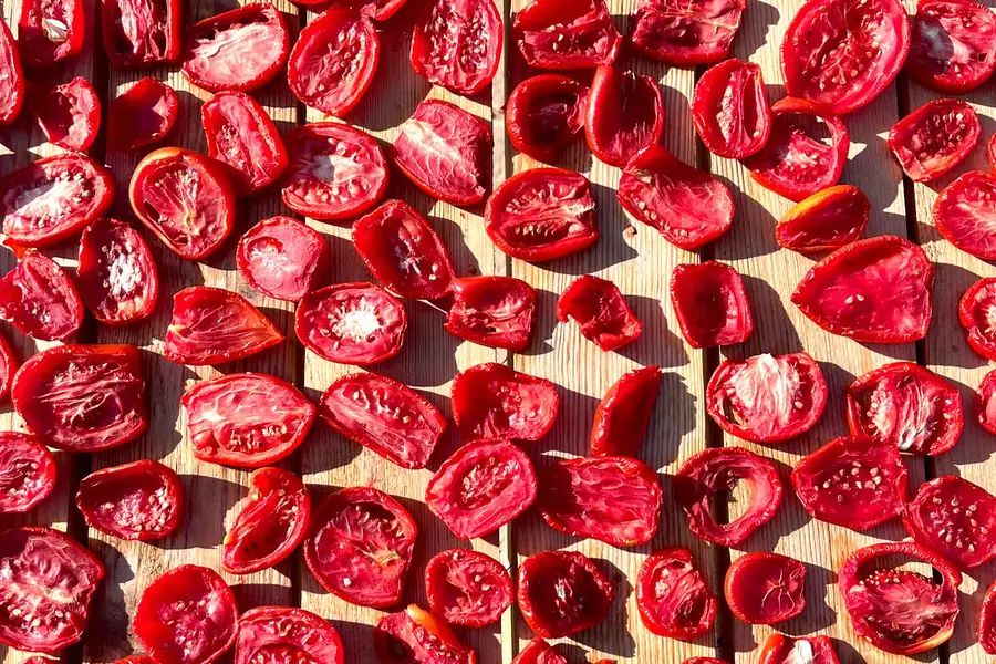 Dried tomatoes on a wooden surface