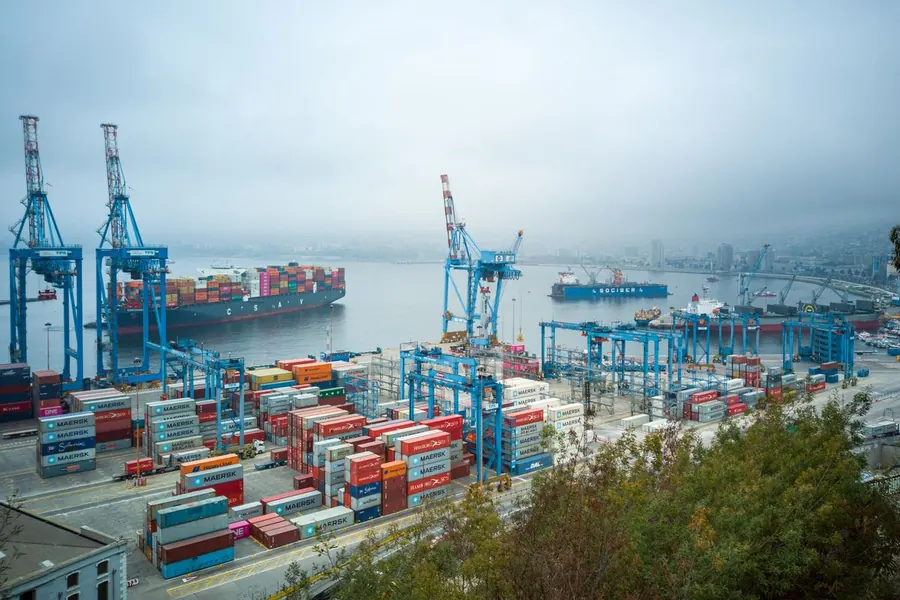 Container port with cranes and stacked shipping containers